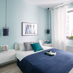 Blue wallpaper in the bedroom interior