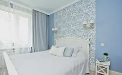 Blue wallpaper in the bedroom interior