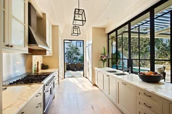 Kitchen design with a window along a long wall