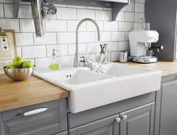 White sink in the kitchen interior