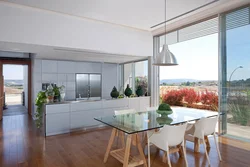 Kitchen living room with panoramic windows in the house design photo