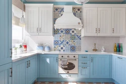 Kitchen with blue wallpaper design