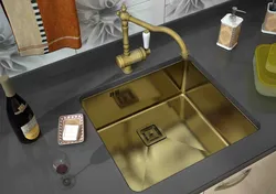 Golden sink in the kitchen interior