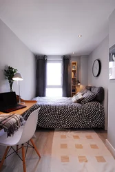 Interior of a narrow bedroom with one window