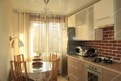 Photo of a kitchen in a three-room apartment in a panel house