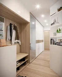 Design of a long hallway in an apartment photo with a wardrobe