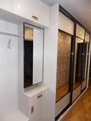 Design of a long hallway in an apartment photo with a wardrobe