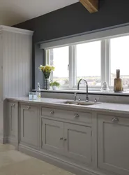 Kitchen design by the window with a sink in the apartment