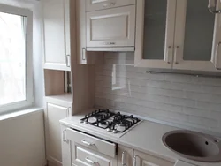 Kitchen options in Khrushchev with a refrigerator and a gas water heater photo