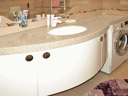 Sink in a stone countertop in a bathroom photo