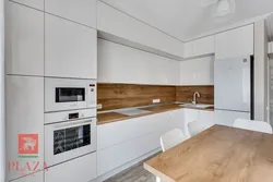 White set with a wooden countertop in the kitchen interior