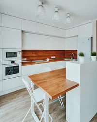 White Set With A Wooden Countertop In The Kitchen Interior