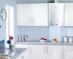 Gas boiler on the wall in the kitchen photo