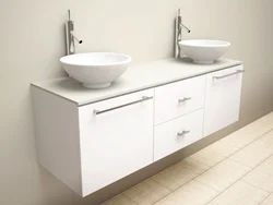 Hanging cabinets in the bathroom with a sink photo
