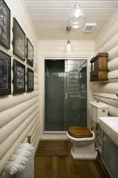 Interior of a bathroom with shower in a wooden house