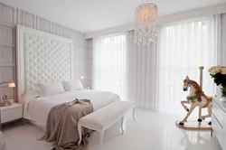 Curtains in the bedroom in the interior white wallpaper