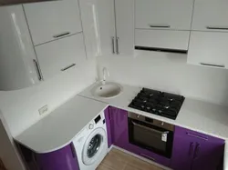 Kitchen design with geyser and washing machine