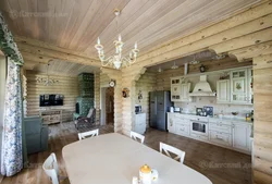Kitchen living room in a log house photo