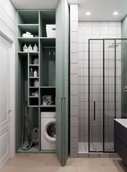 Bathroom With Shower Cabin Design In Apartment And Washing Machine