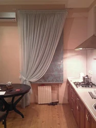 One Curtain In The Kitchen Photo