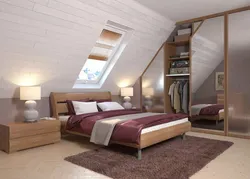 Attic bedroom with sloping ceiling design photo