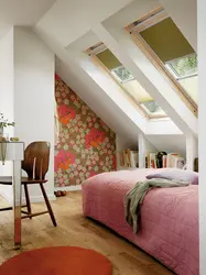 Attic bedroom with sloping ceiling design photo