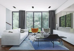 Living room design in a house with floor-to-ceiling windows