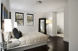 Dark floor in the bedroom interior photo