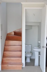 Bathroom Design In A House Under The Stairs
