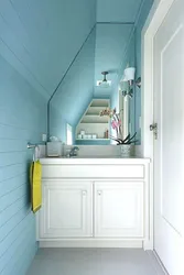 Bathroom design in a house under the stairs
