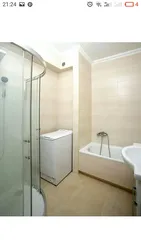 Bathroom design with vertical washing machine