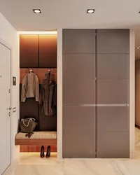 Built-in wardrobe in the hallway with hinged doors modern design photo