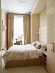 Rectangular bedroom interior with one window photo
