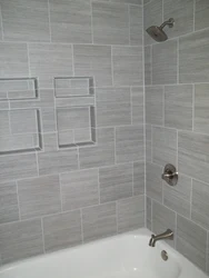 Photo Of A Bathtub With Grout Matching The Color Of The Tiles