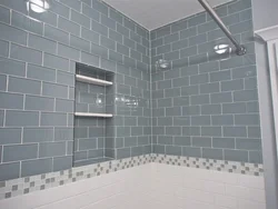 Photo Of A Bathtub With Grout Matching The Color Of The Tiles