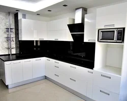 Kitchen interior with black and white apron photo