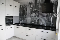 Kitchen interior with black and white apron photo