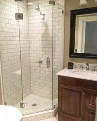Shower In The Bathroom With A Tray Made Of Small Tiles Photo