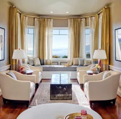 Living room interior with three windows