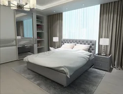 Интерьер спальни с кроватью серого цвета