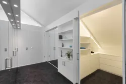 Гардеробная комната в мансарде со скошенным потолком фото
