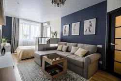 Photo of living room interior with bed and sofa