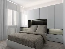 Спальня со шкафом в изголовье кровати дизайн