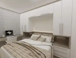 Bedroom with wardrobe at the head of the bed design