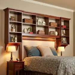 Shelves above the bed in the bedroom interior
