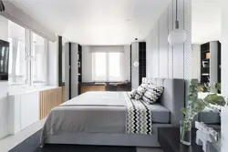 Bedroom design with a window and a balcony on one wall