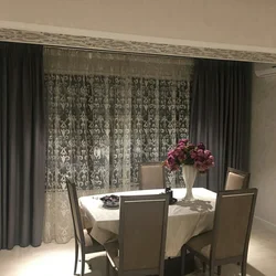 Gray beige curtains in the kitchen interior