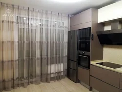 Gray beige curtains in the kitchen interior