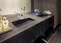 Countertop in the bathroom under the sink made of porcelain stoneware photo