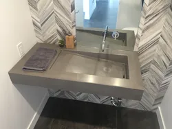 Countertop in the bathroom under the sink made of porcelain stoneware photo